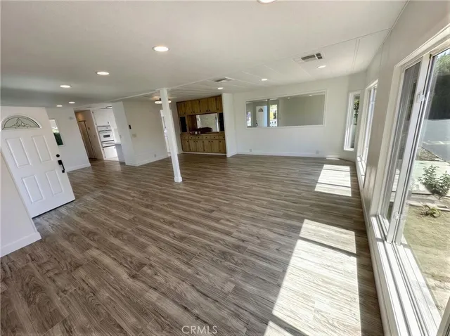 a view of a living room with a large window