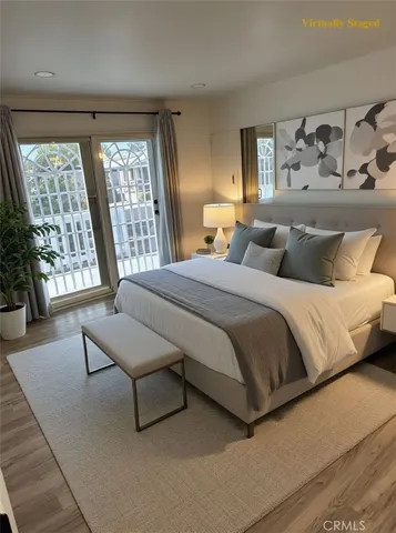 a bedroom with a bed and a large window