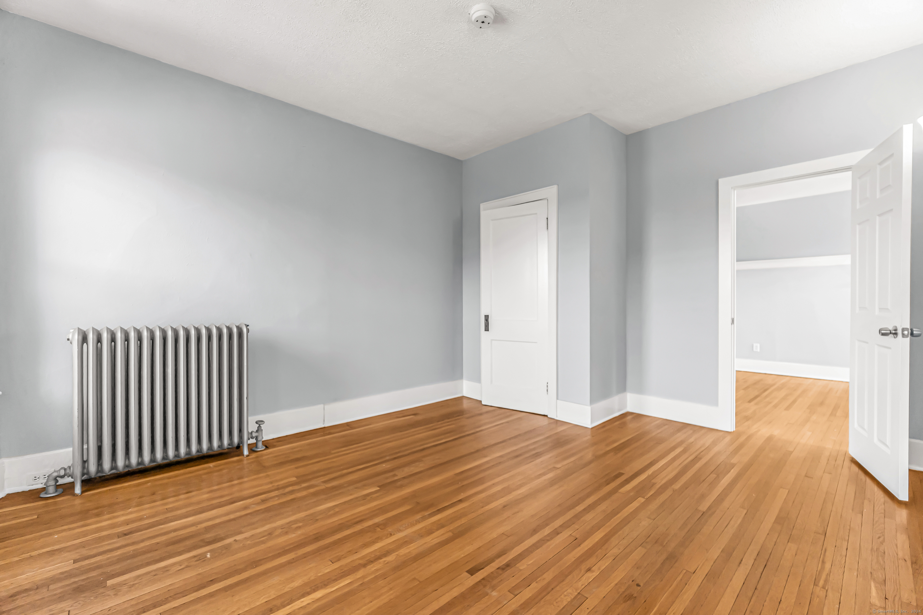 2679 Fairfield Avenue, Unit 2 Bridgeport, CT 06605 - Photo 12 of 22 a view of a room with wooden floor