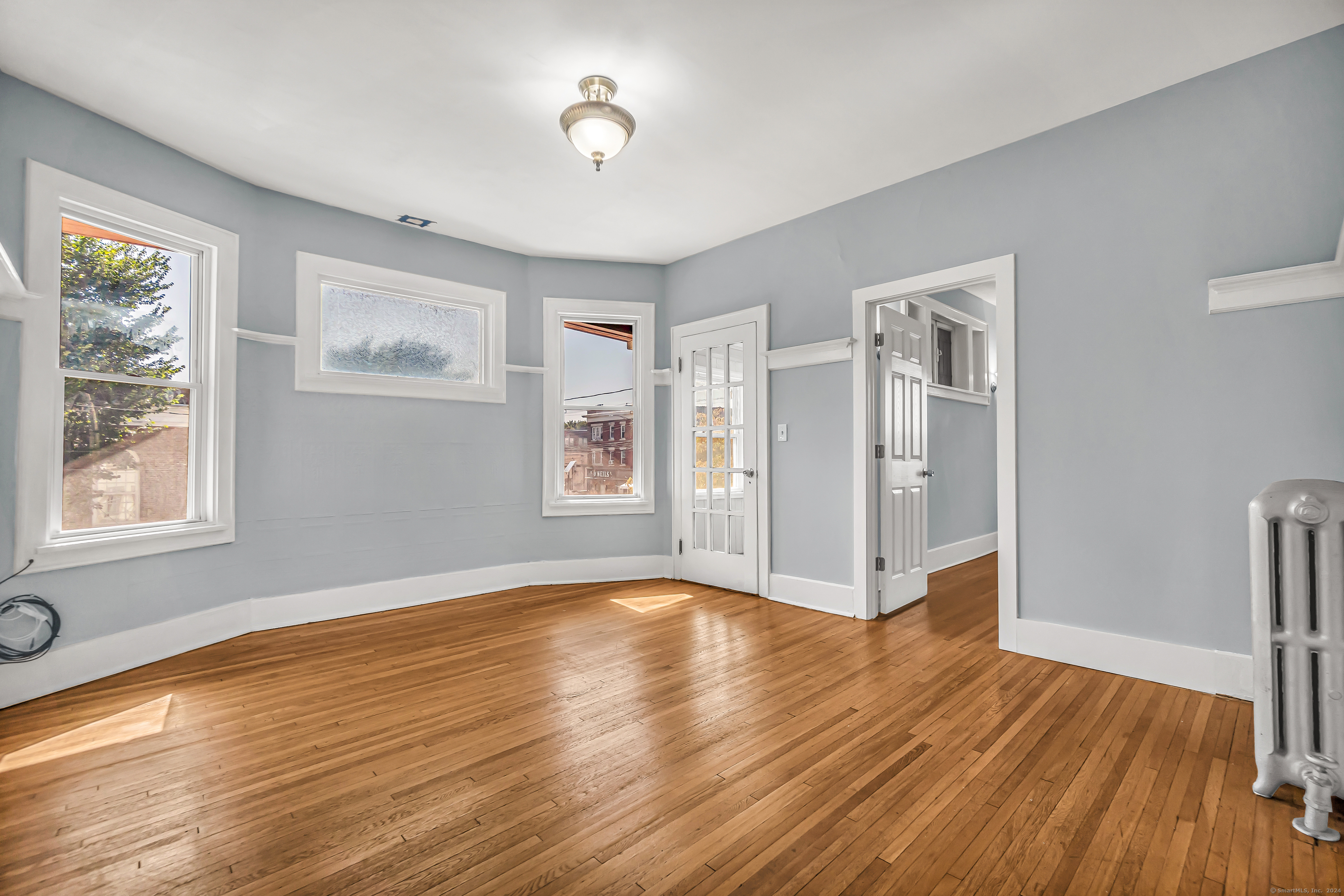 2679 Fairfield Avenue, Unit 2 Bridgeport, CT 06605 - Photo 14 of 22 a view of livingroom with hardwood floor and window