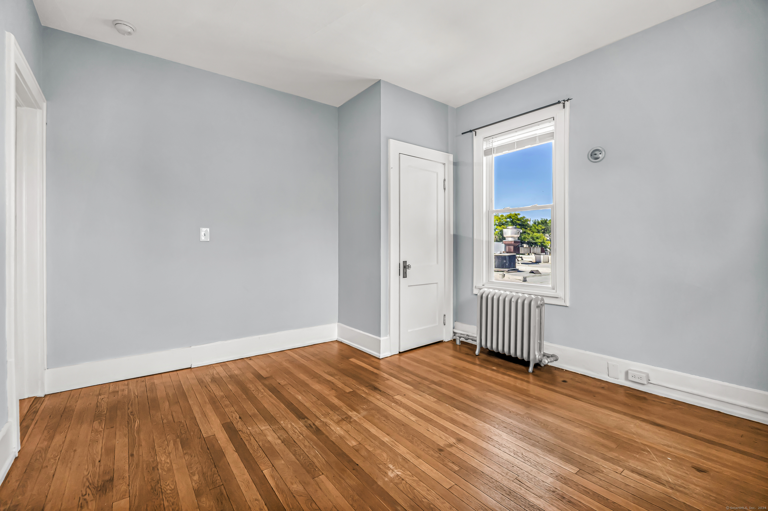 2679 Fairfield Avenue, Unit 2 Bridgeport, CT 06605 - Photo 16 of 22 a view of empty room with wooden floor