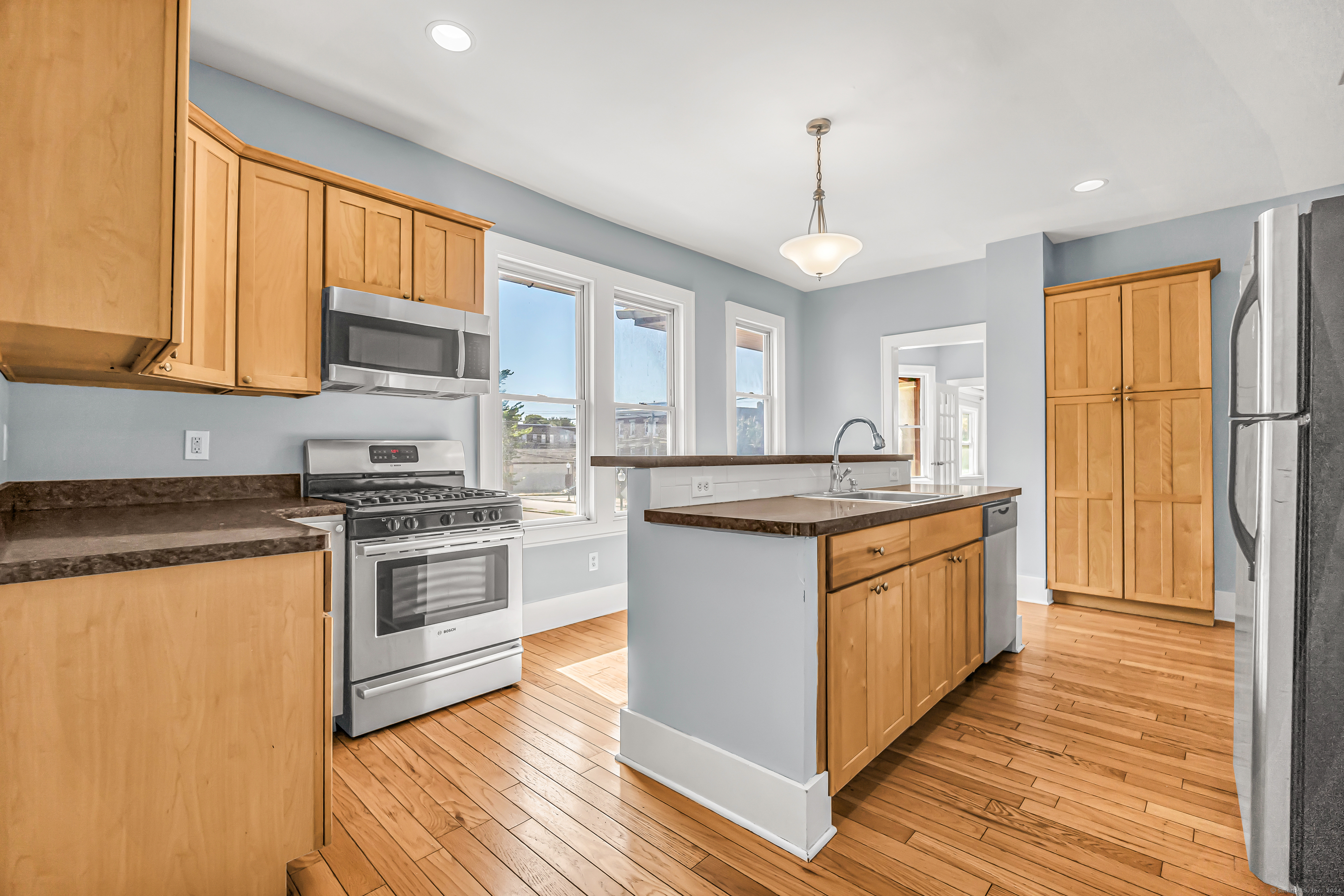2679 Fairfield Avenue, Unit 2 Bridgeport, CT 06605 - Photo 3 of 22 a kitchen with stainless steel appliances granite countertop a stove a sink and a refrigerator