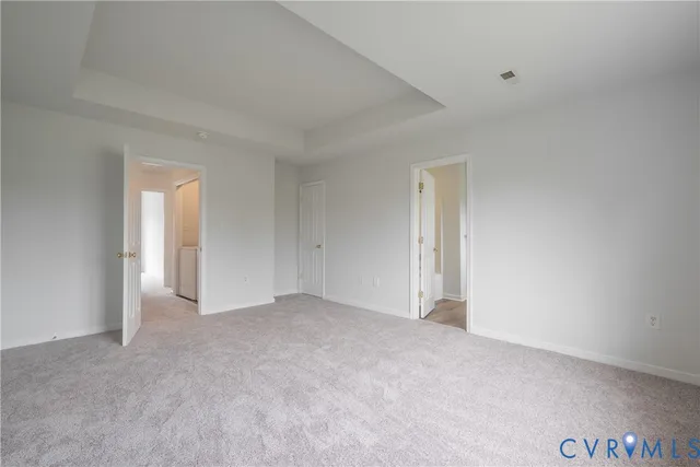 a view of an empty room and a window