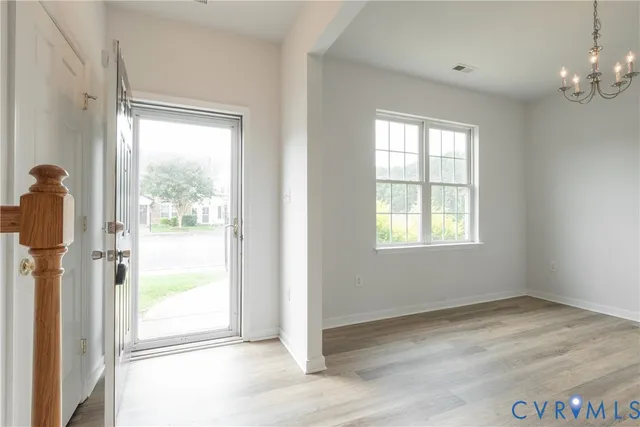 a view of livingroom with furniture wooden floor and window