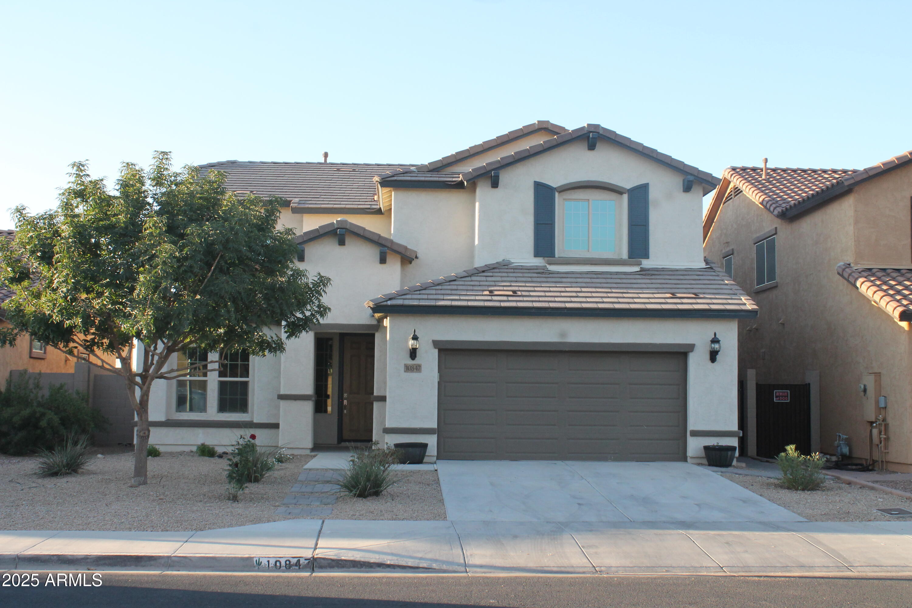 10847 West Nosean Road Peoria, AZ 85383 - Photo 1 of 11 a front view of a house with garage