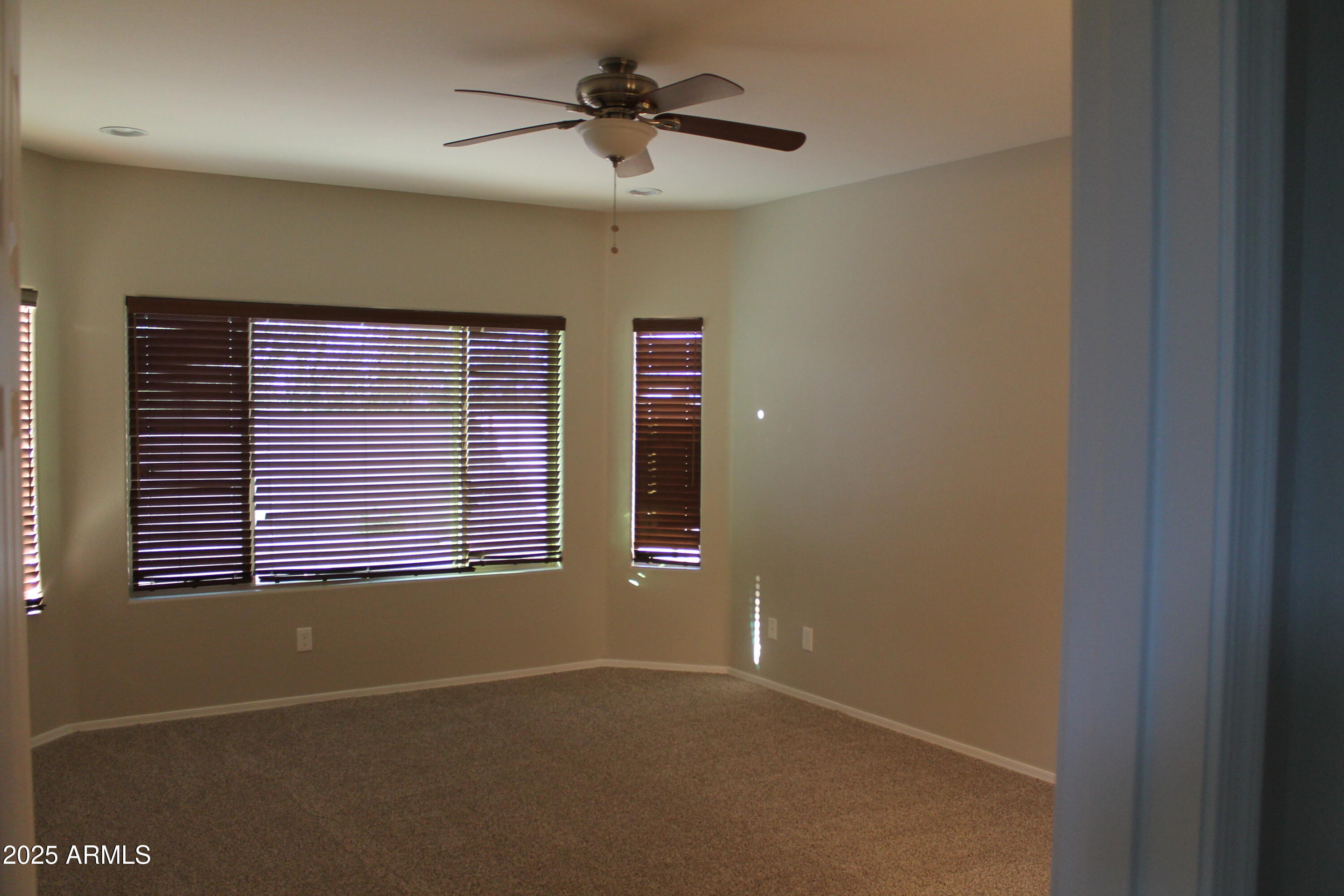 10847 West Nosean Road Peoria, AZ 85383 - Photo 9 of 11 a view of an empty room with a window