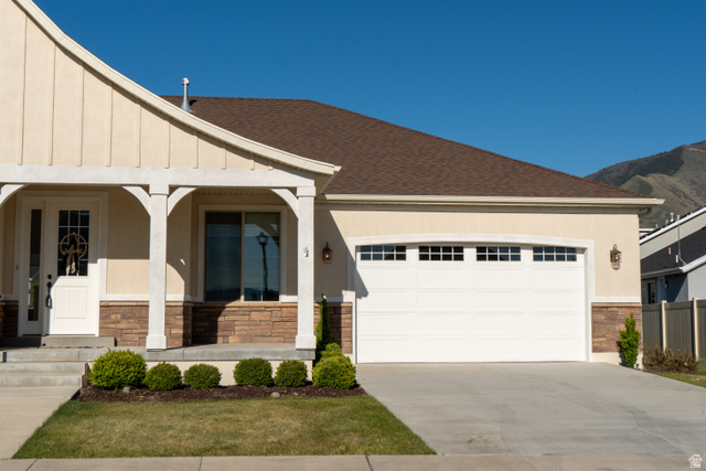 1222 West 190th Street North Mapleton, UT 84664 - Photo 45 of 46 Stucco exterior with stone accents, covered entry, and attached garage with transom windows