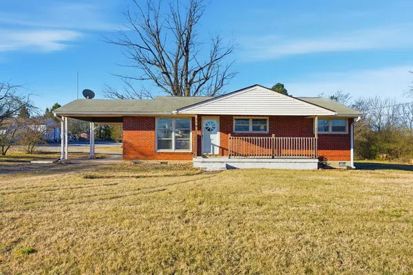 a front view of a house with swimming pool