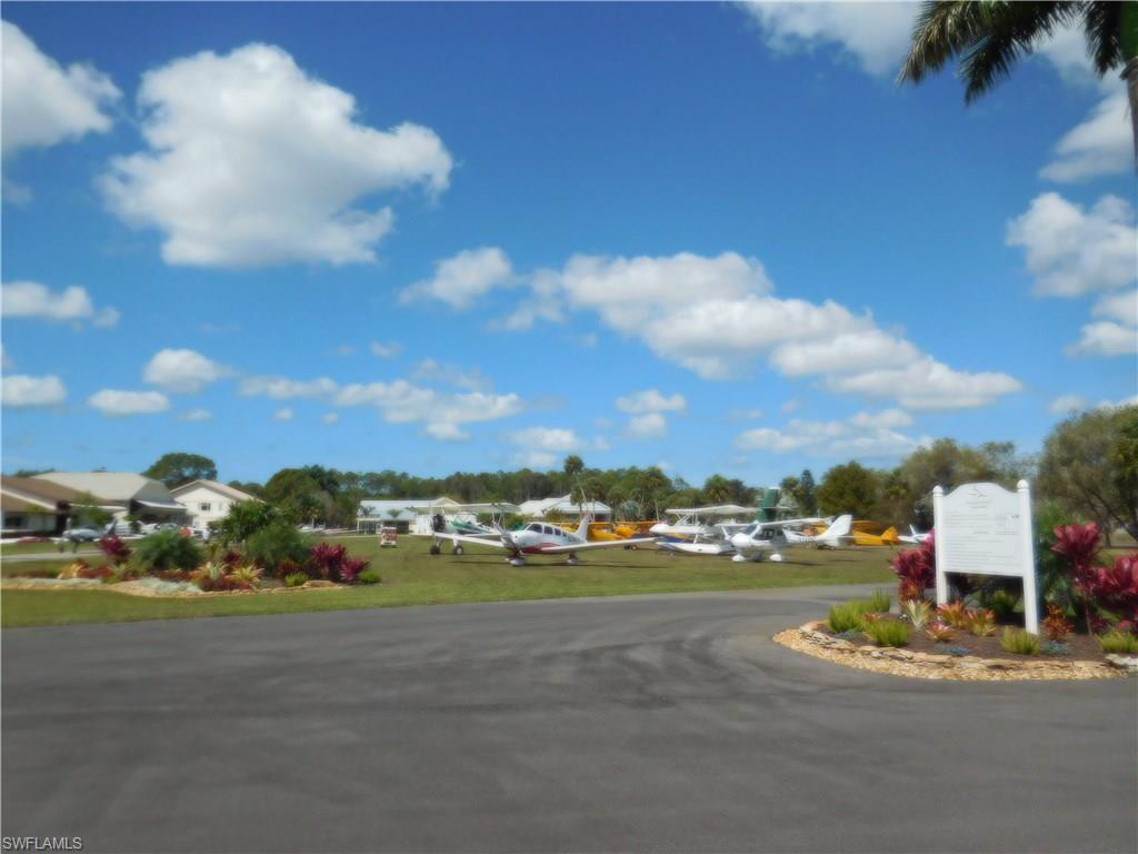 4072 Skyway Drive Naples, FL 34112 - Photo 8 of 11 a view of a town with big building