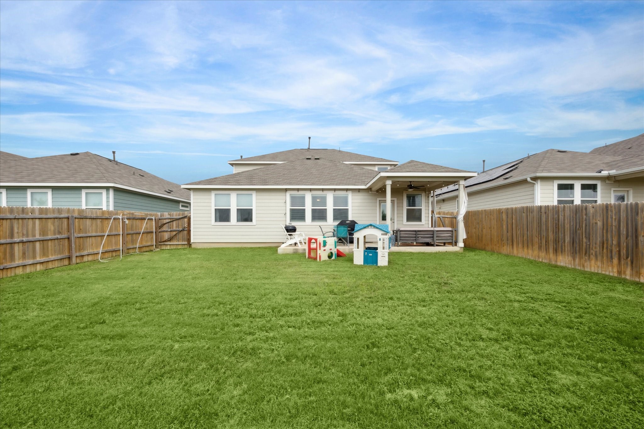 2005 Jacey Way Austin, TX 78725 - Photo 15 of 17 Spacious yard with extended and covered patio