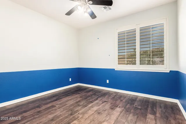 a view of room with hardwood floor