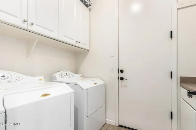 a view of a house with backyard porch and sitting area