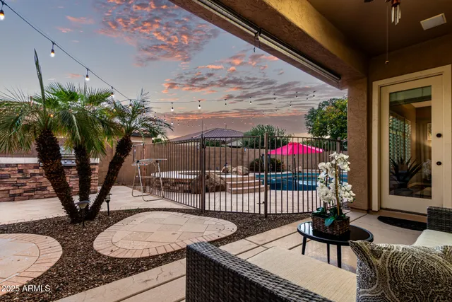 a house view with a swimming pool and outdoor seating