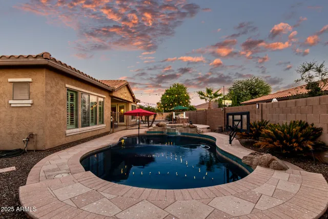 a view of a patio with a table and chairs