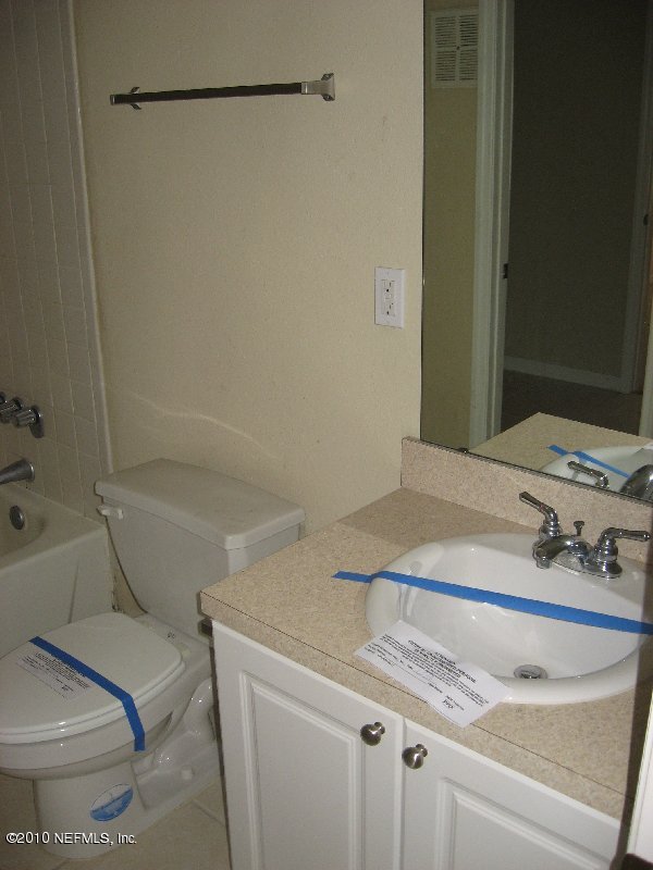 355 Monument Road, Unit 17 D2 Jacksonville, FL 32225 - Photo 8 of 10 a bathroom with a sink and a toilet