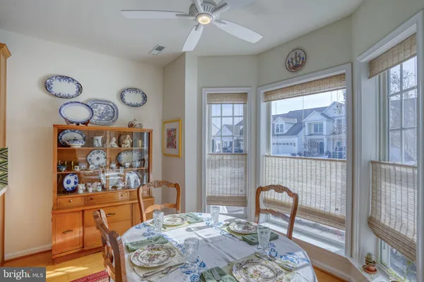 a kitchen with stainless steel appliances granite countertop a sink and a refrigerator