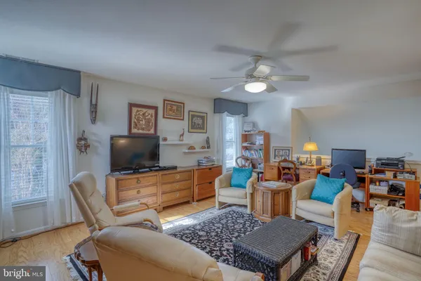 a bedroom with furniture and a wooden floor