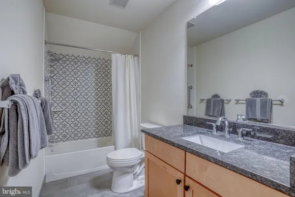 a bedroom with a bed and dresser