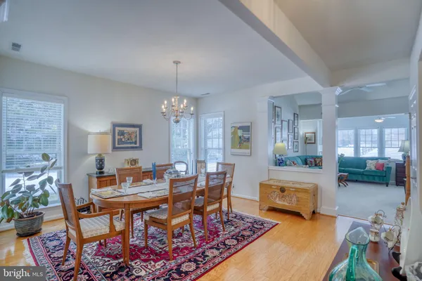 a dining room with furniture and window