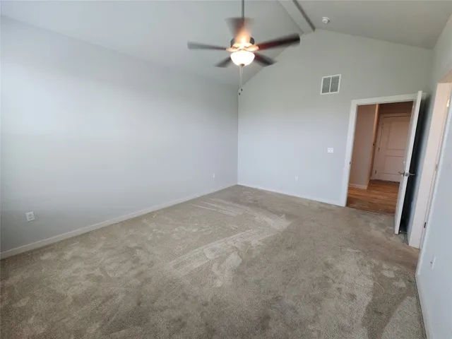 a spacious bathroom with a double vanity sink and a mirror