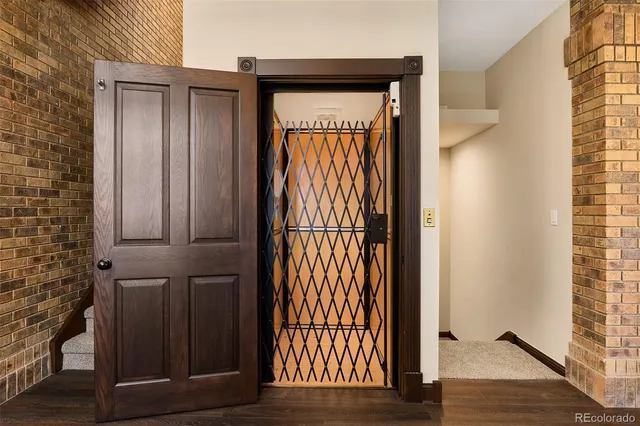a kitchen with stainless steel appliances granite countertop a sink a stove and refrigerator