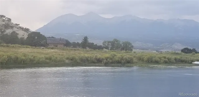 a view of an ocean and a mountain