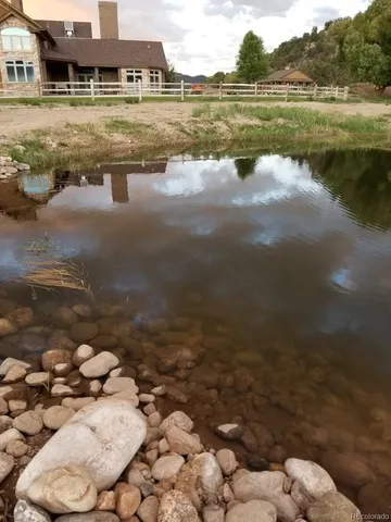 a view of a lake with a big yard