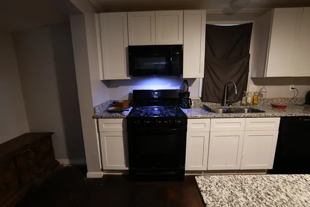 a kitchen with a stove and a microwave