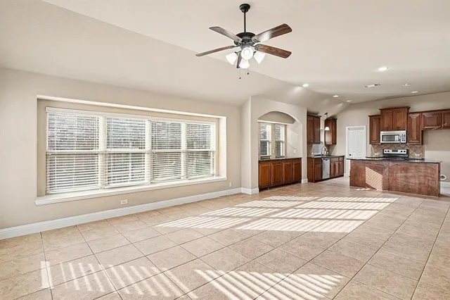 a view of a livingroom with a kitchen