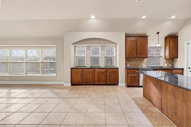 a view of a kitchen with a sink and a dishwasher