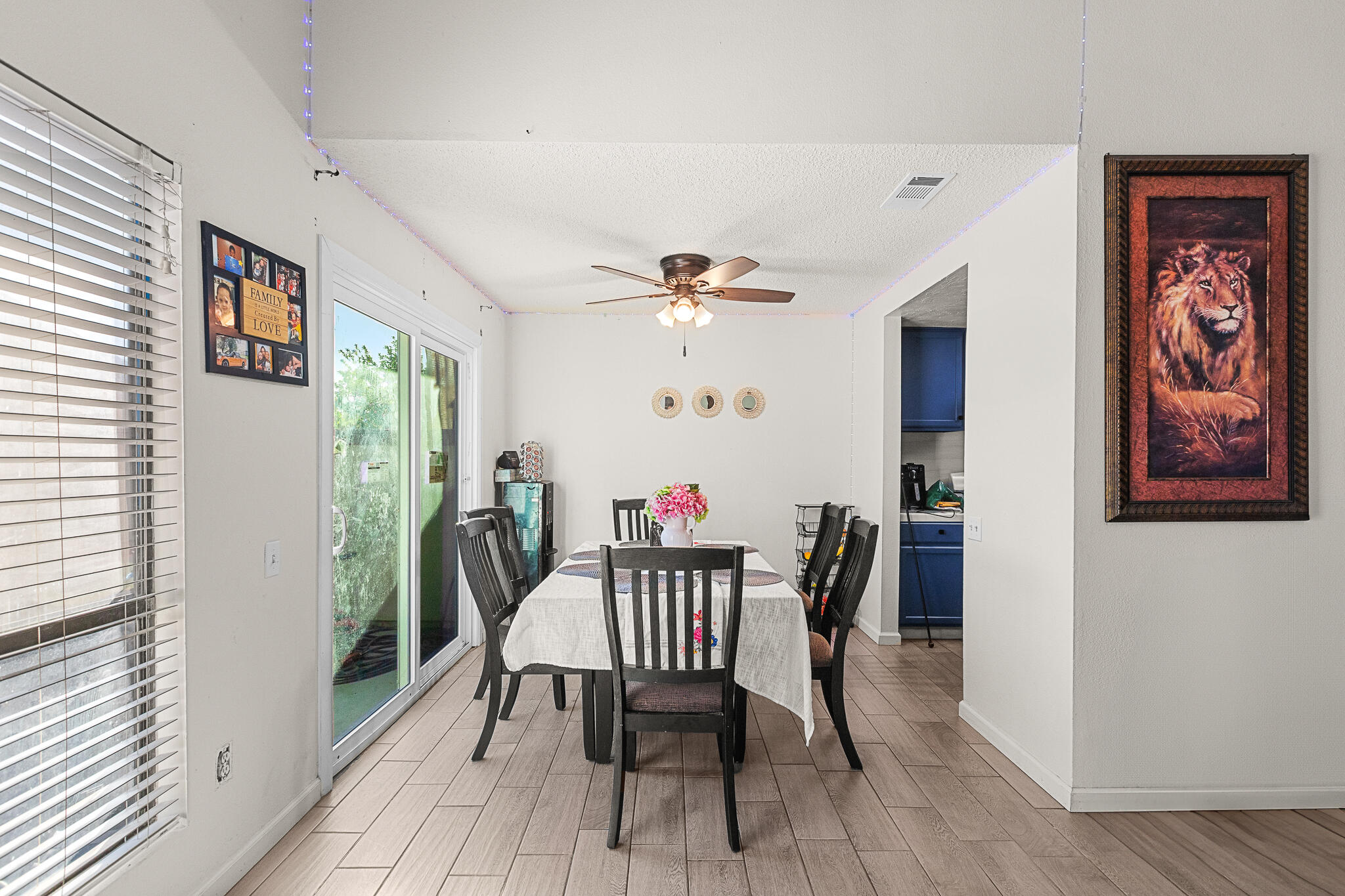 a view of a dining room with furniture and wooden floor