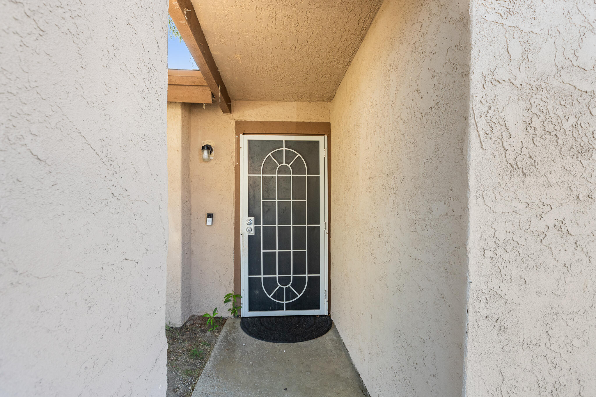 45546 Aladdin Street, Unit A101 Indio, CA 92201 - Photo 12 of 22 a view of a door and wooden floor