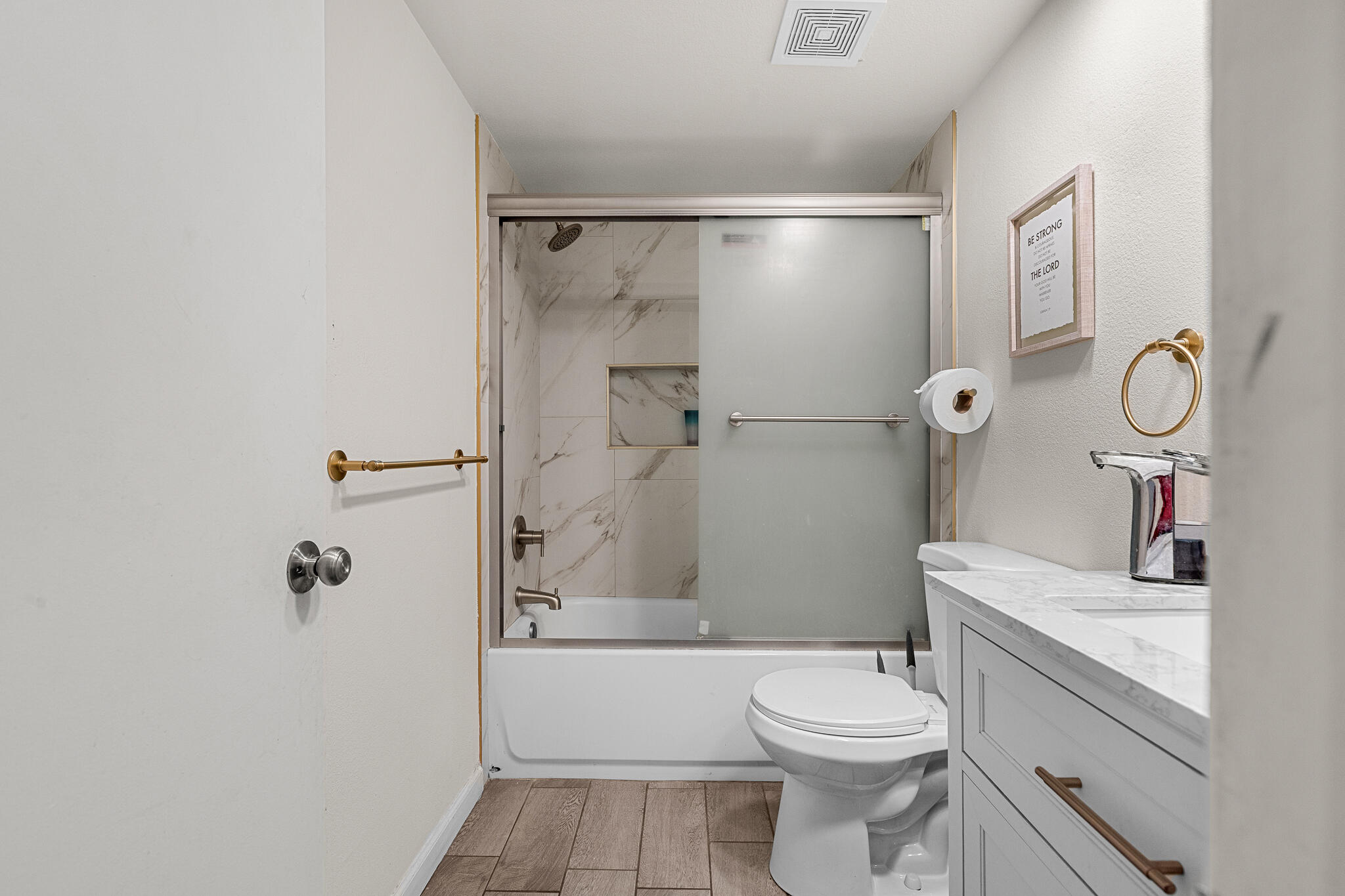 45546 Aladdin Street, Unit A101 Indio, CA 92201 - Photo 14 of 22 a bathroom with a granite countertop sink a toilet and shower