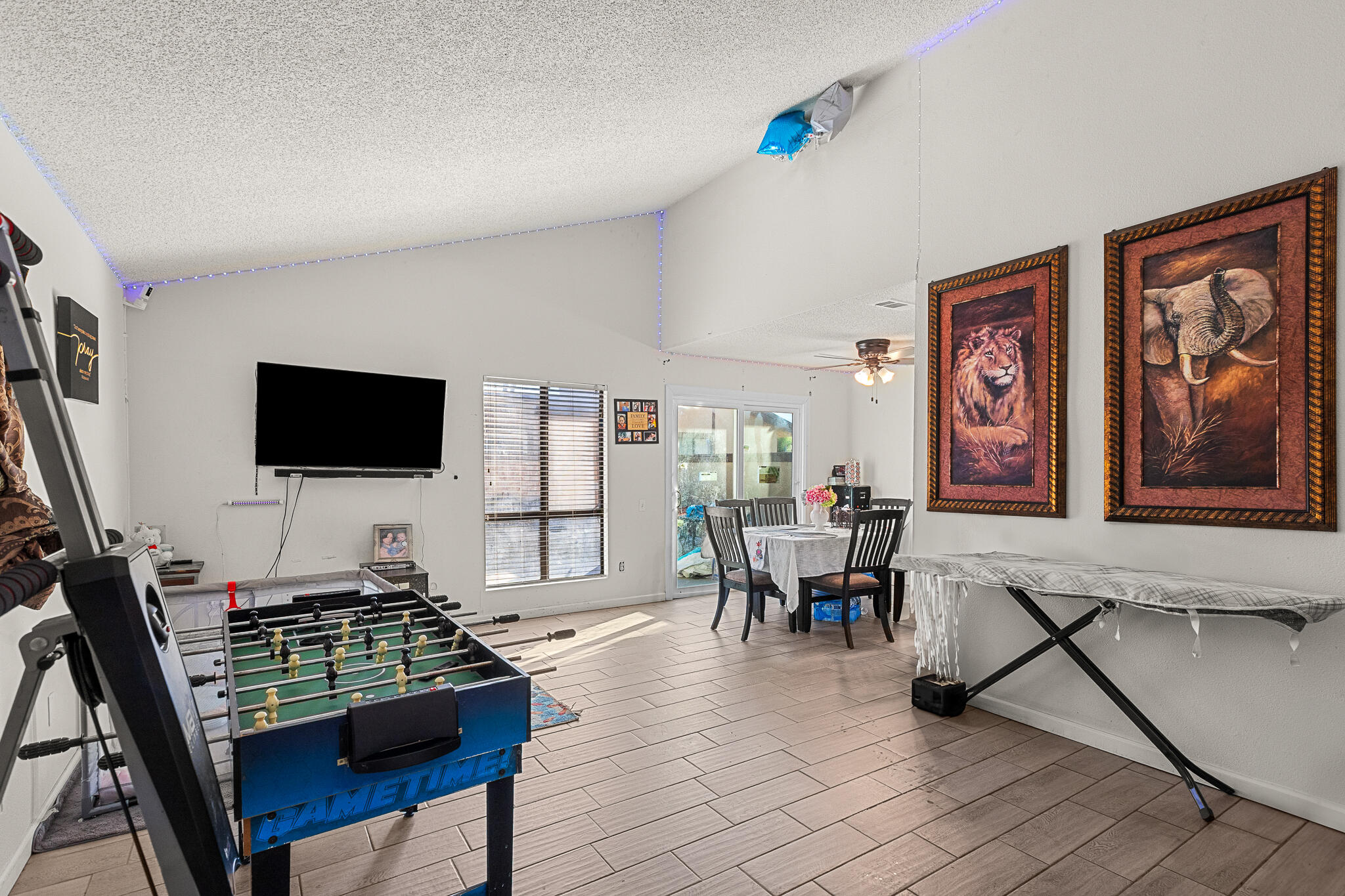 45546 Aladdin Street, Unit A101 Indio, CA 92201 - Photo 15 of 22 a living room with furniture and a flat screen tv
