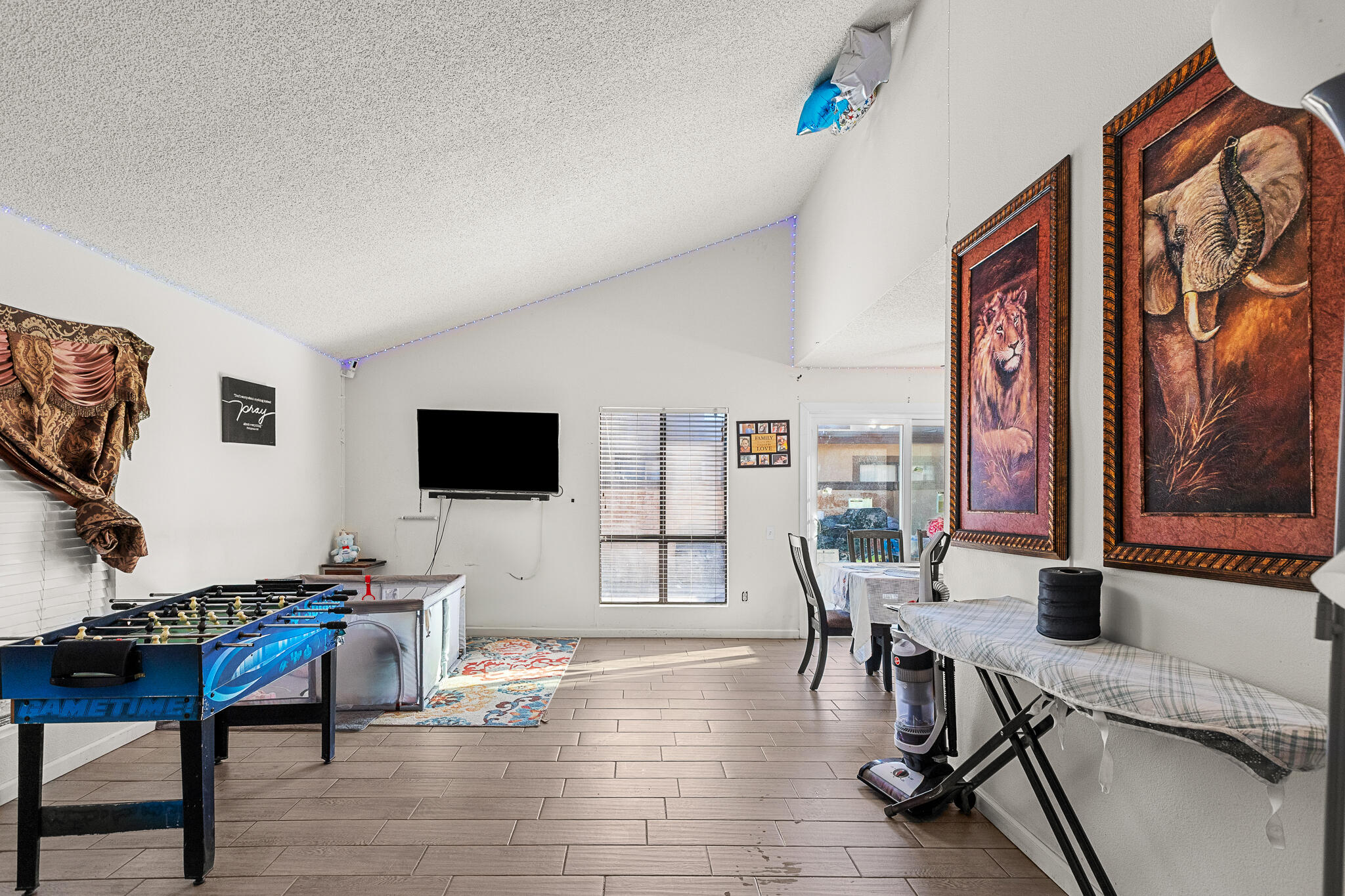 45546 Aladdin Street, Unit A101 Indio, CA 92201 - Photo 16 of 22 a living room with furniture and a flat screen tv