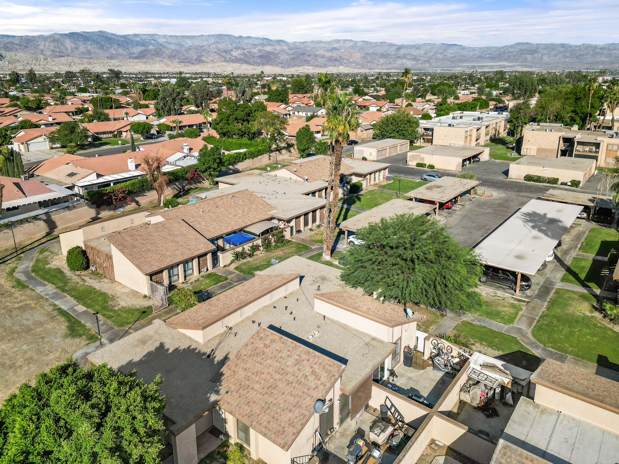 45546 Aladdin Street, Unit A101 Indio, CA 92201 - Photo 6 of 22 an aerial view of a city with lots of residential buildings