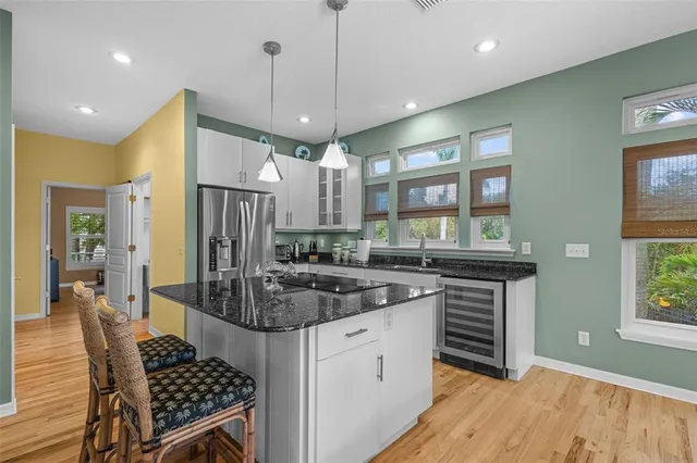 a dining room with furniture a window and a chandelier