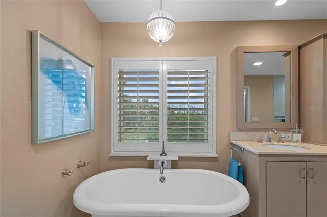 a view of a room with wooden floor and a floor to ceiling window