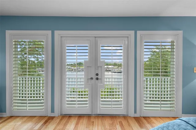 a view of a porch with furniture and wooden floor