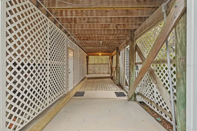 an aerial view of a house with outdoor space and lake view