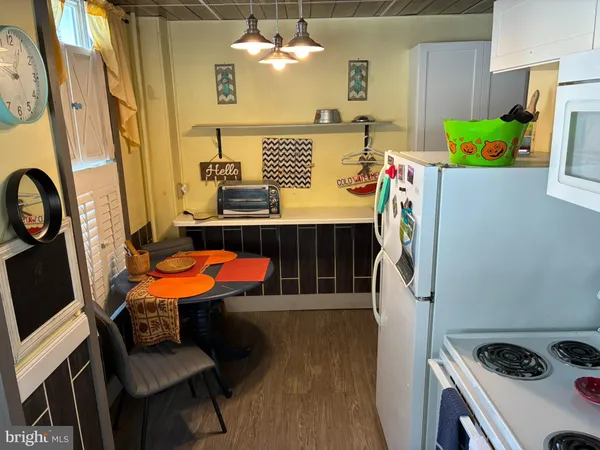 a room with furniture a washer and dryer