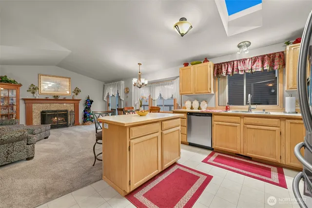 a kitchen with sink cabinets and window