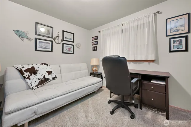 a work room with furniture and a window