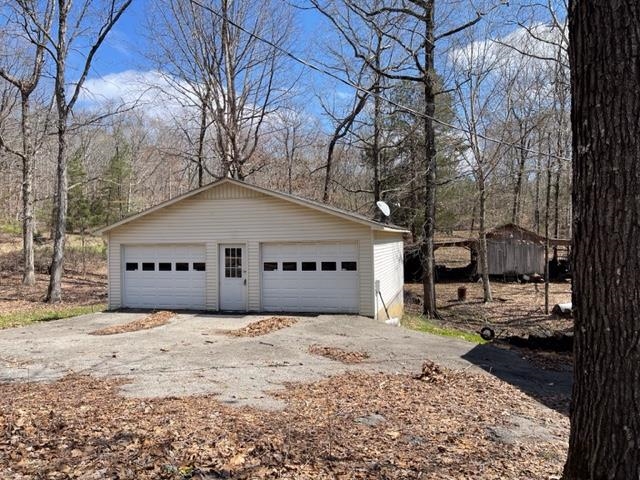 620 Harris Road Bolivar, TN 38008 - Photo 2 of 24 a front view of a house with a yard covered in snow
