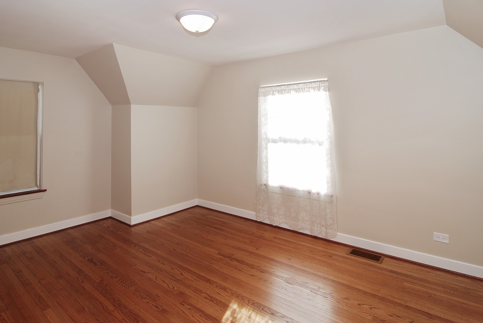 42 Northgate Road Riverside, IL 60546 - Photo 8 of 25 an empty room with wooden floor and windows