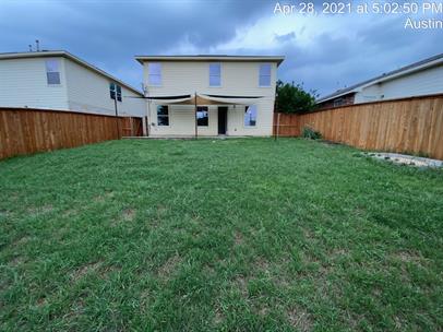 5713 Silver Screen Drive Austin, TX 78747 - Photo 19 of 21 Back of house featuring a fenced backyard and a patio area