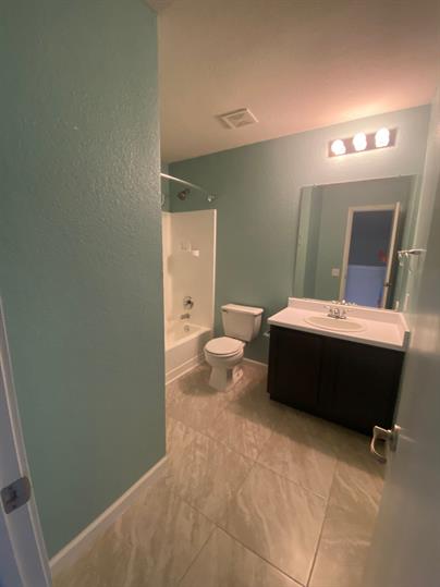 5713 Silver Screen Drive Austin, TX 78747 - Photo 20 of 21 Full bath with vanity and bathtub / shower combination
