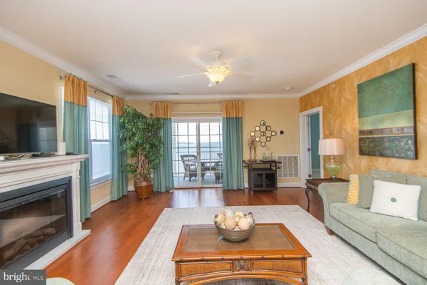 a living room with furniture fireplace and flat screen tv