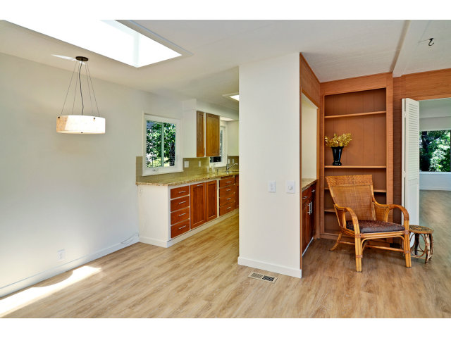 552 Bean Creek Road, Unit 88 Scotts Valley, CA 95066 - Photo 11 of 25 a kitchen with kitchen island granite countertop wooden floors and a view of living room
