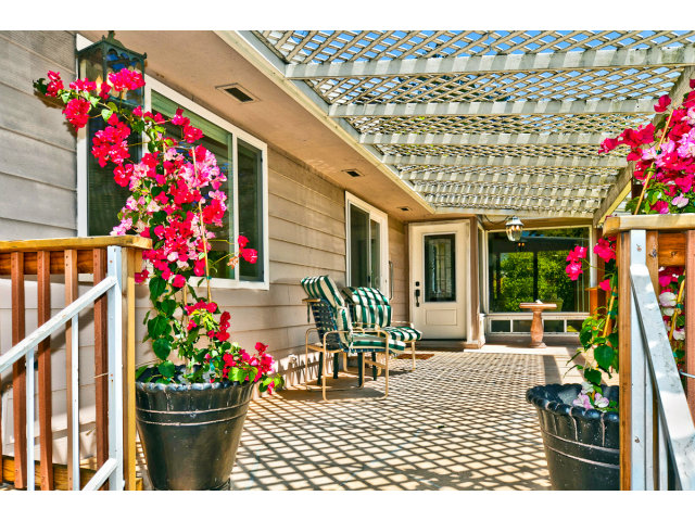 552 Bean Creek Road, Unit 88 Scotts Valley, CA 95066 - Photo 21 of 25 a front view of a house with lots of flowers